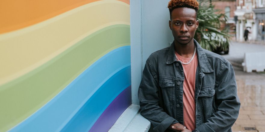 Person and rainbow wall